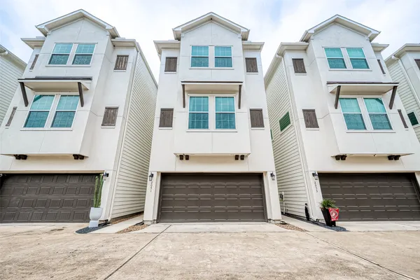a front view of a house with garage