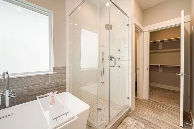 a bathroom with a shower and a sink