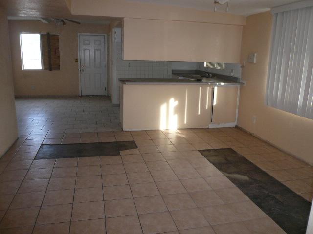 3702 West Griswold Road Phoenix, AZ 85051 - Photo 4 of 6 family room to kitchen