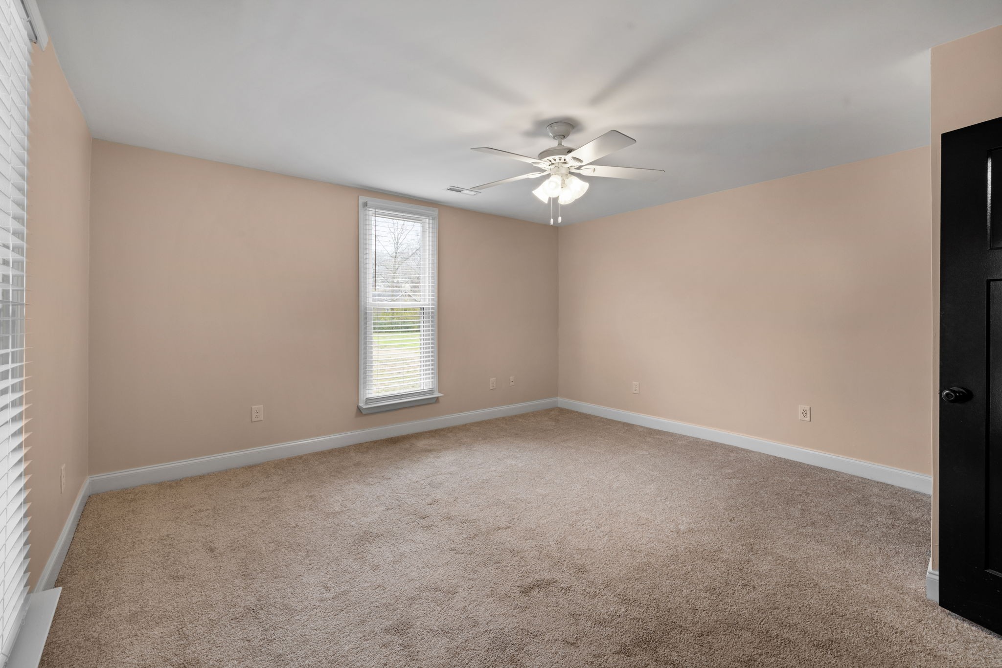 106 East 9th Street Columbia, TN 38401 - Photo 14 of 94 an empty room with a window and a fan