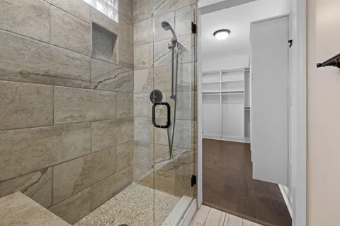 a kitchen with stainless steel appliances granite countertop a refrigerator a sink and a stove