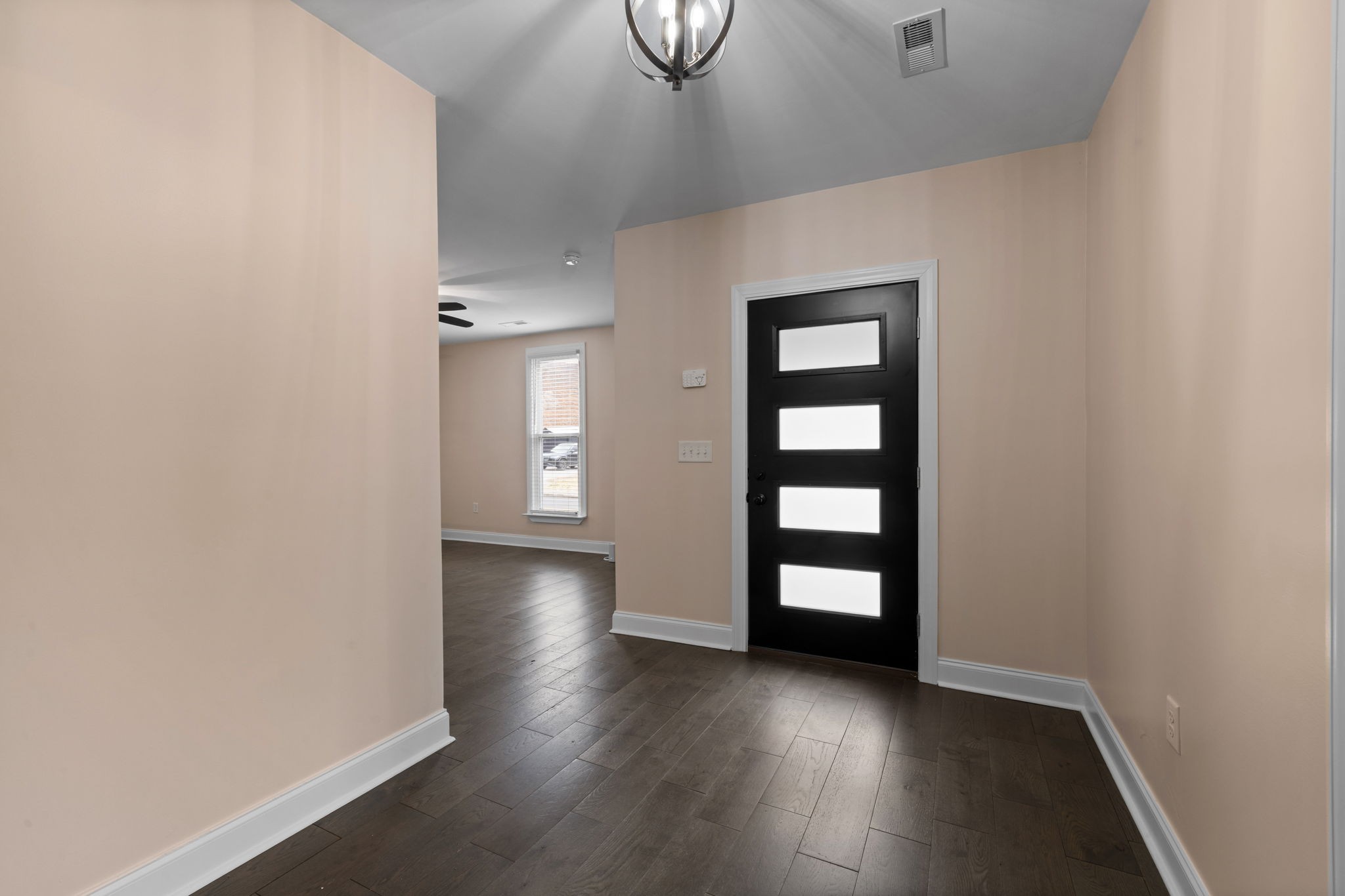 106 East 9th Street Columbia, TN 38401 - Photo 29 of 94 an empty room with wooden floor cabinet and window