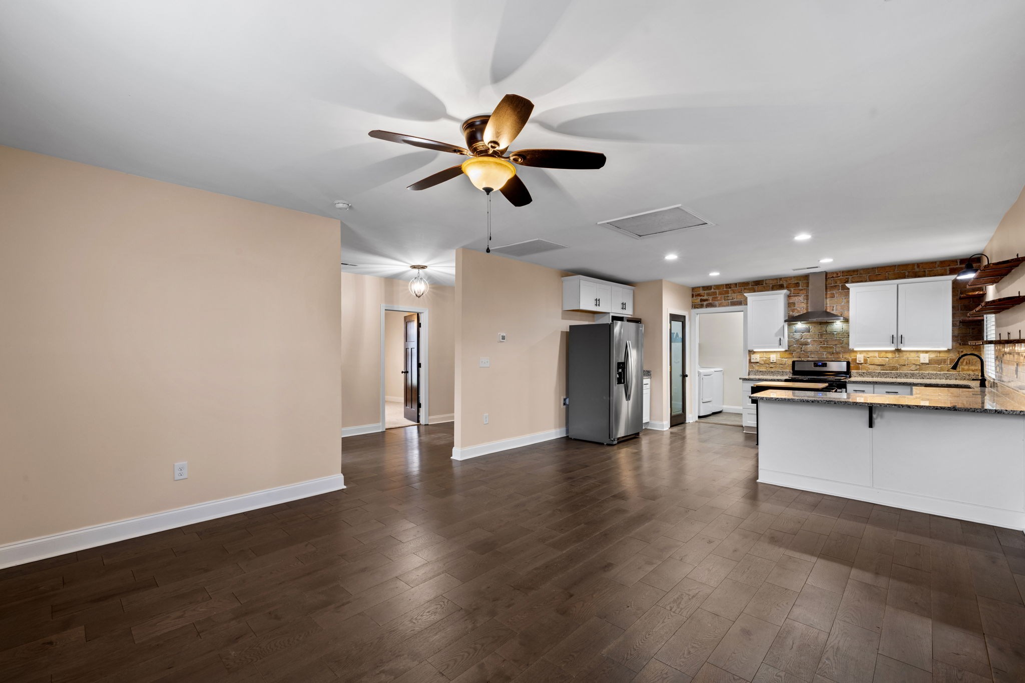 106 East 9th Street Columbia, TN 38401 - Photo 35 of 94 a view of a kitchen with a sink a ceiling fan and wooden floor
