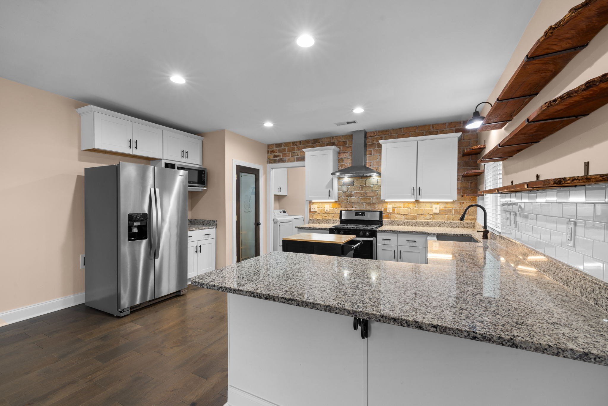 106 East 9th Street Columbia, TN 38401 - Photo 39 of 94 a kitchen with stainless steel appliances granite countertop a refrigerator a stove and a sink