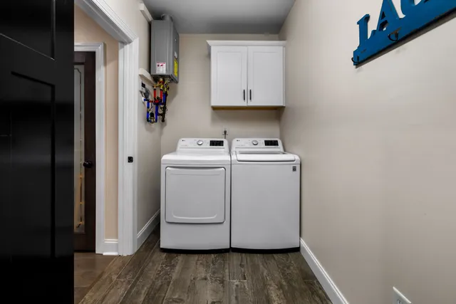 an aerial view of residential houses with city view