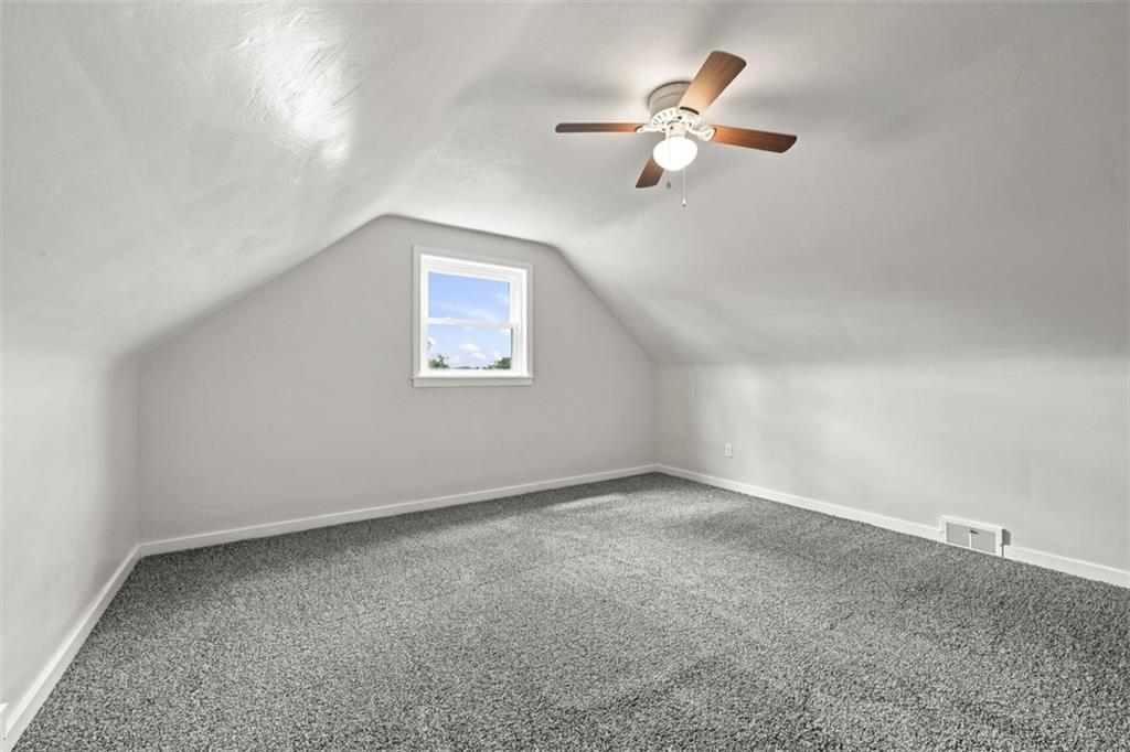 545 Center Hill Road Pittsburgh, PA 15239 - Photo 28 of 48 A window brings in natural light, while a ceiling fan provides added comfort.