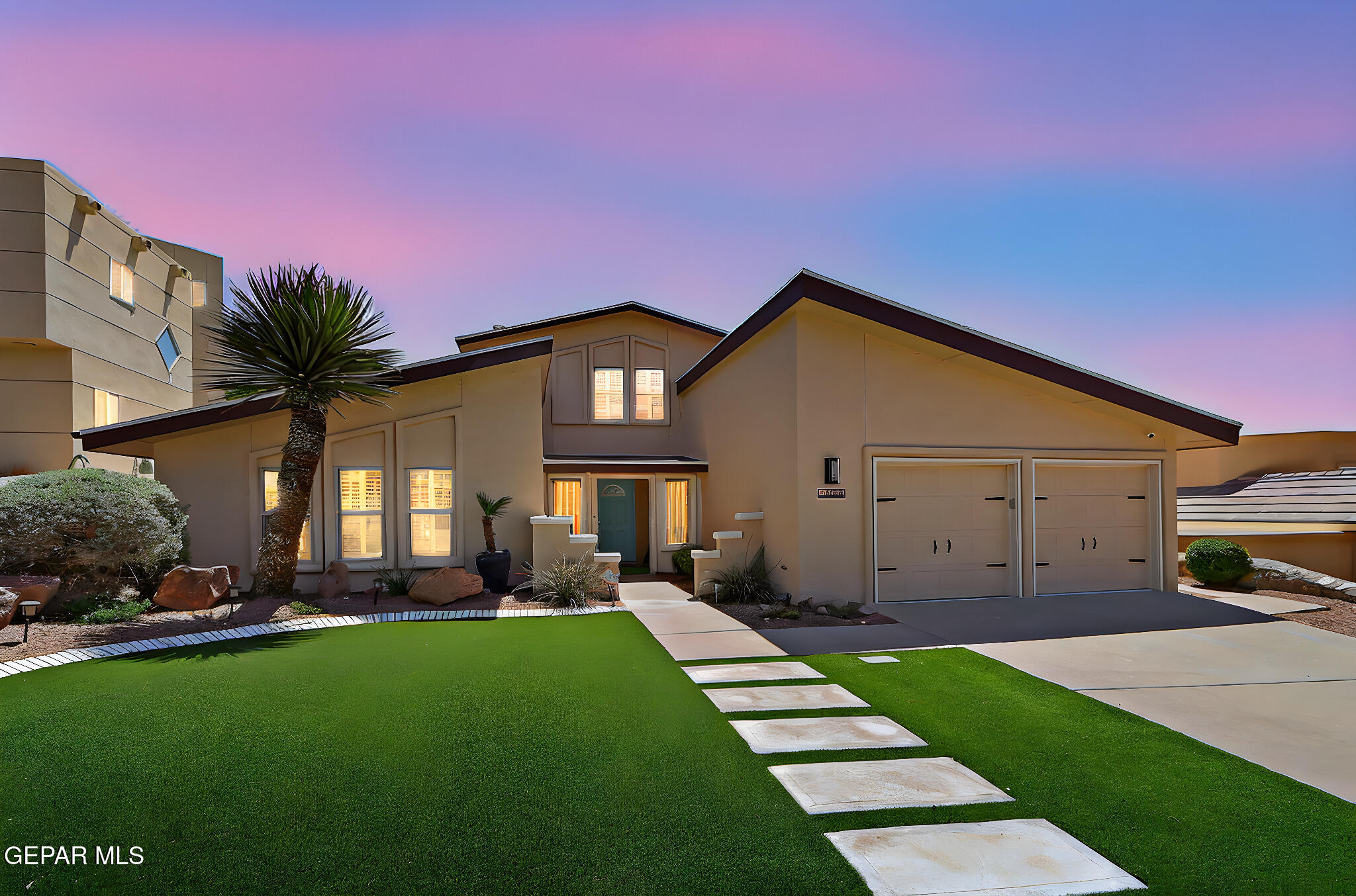 672 Moondale Drive El Paso, TX 79912 - Photo 1 of 1 a front view of a house with a garden and yard