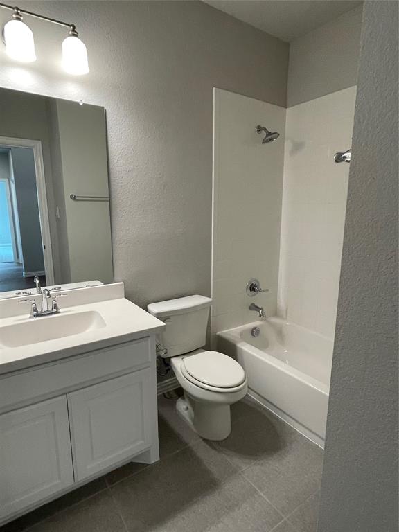 13969 Falcon Ranch Drive Frisco, TX 75035 - Photo 16 of 25 a bathroom with a double vanity sink toilet mirror and bathtub