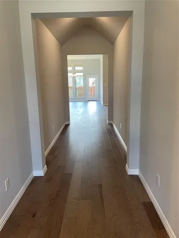 wooden floor in a hall with an entryway