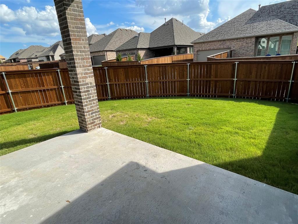 13969 Falcon Ranch Drive Frisco, TX 75035 - Photo 22 of 25 a view of a backyard with a garden