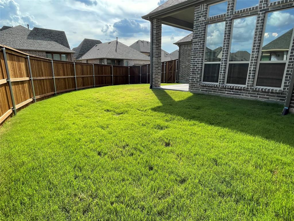 13969 Falcon Ranch Drive Frisco, TX 75035 - Photo 24 of 25 a view of a house with a yard and porch