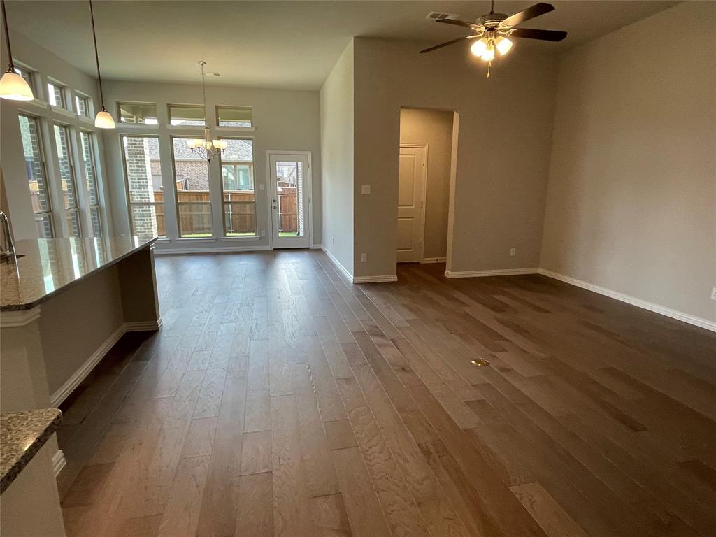 13969 Falcon Ranch Drive Frisco, TX 75035 - Photo 3 of 25 an empty room with wooden floor and windows