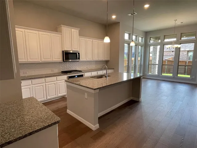 a kitchen with granite countertop counter top space cabinets and a sink