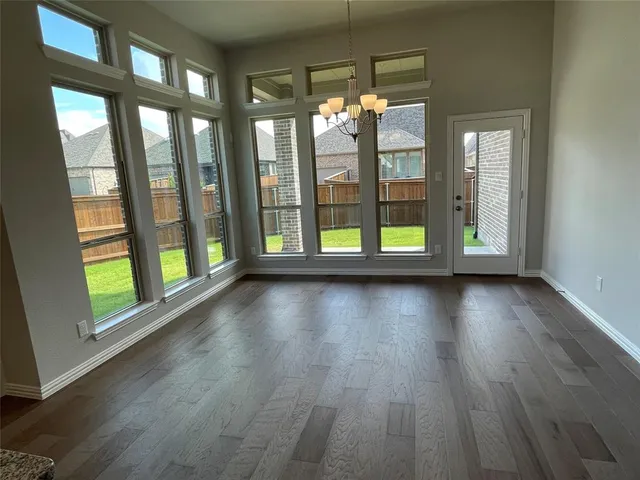 a view of room with window and hardwood floor