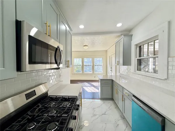 a large kitchen with cabinets