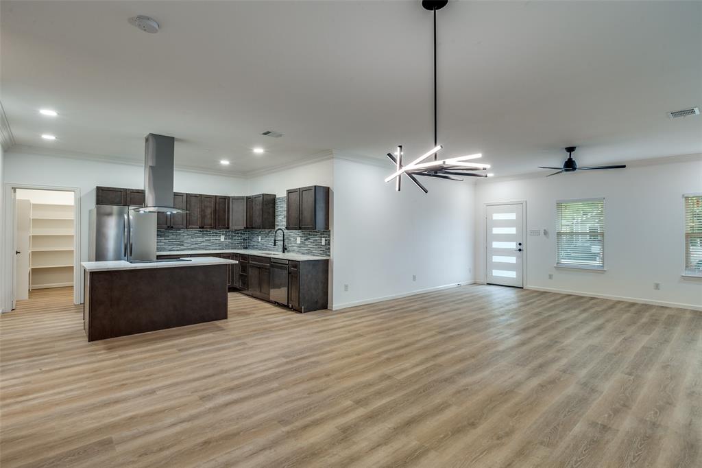 1727 Pear Street Dallas, TX 75215 - Photo 13 of 13 a large kitchen with stainless steel appliances kitchen island a large island in the center