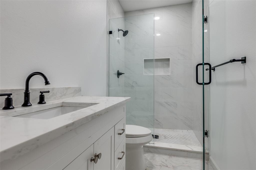 1727 Pear Street Dallas, TX 75215 - Photo 7 of 13 a bathroom with a sink toilet and shower