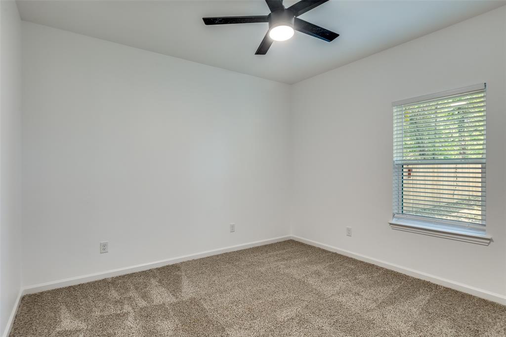 1727 Pear Street Dallas, TX 75215 - Photo 8 of 13 an empty room with a window and a fan