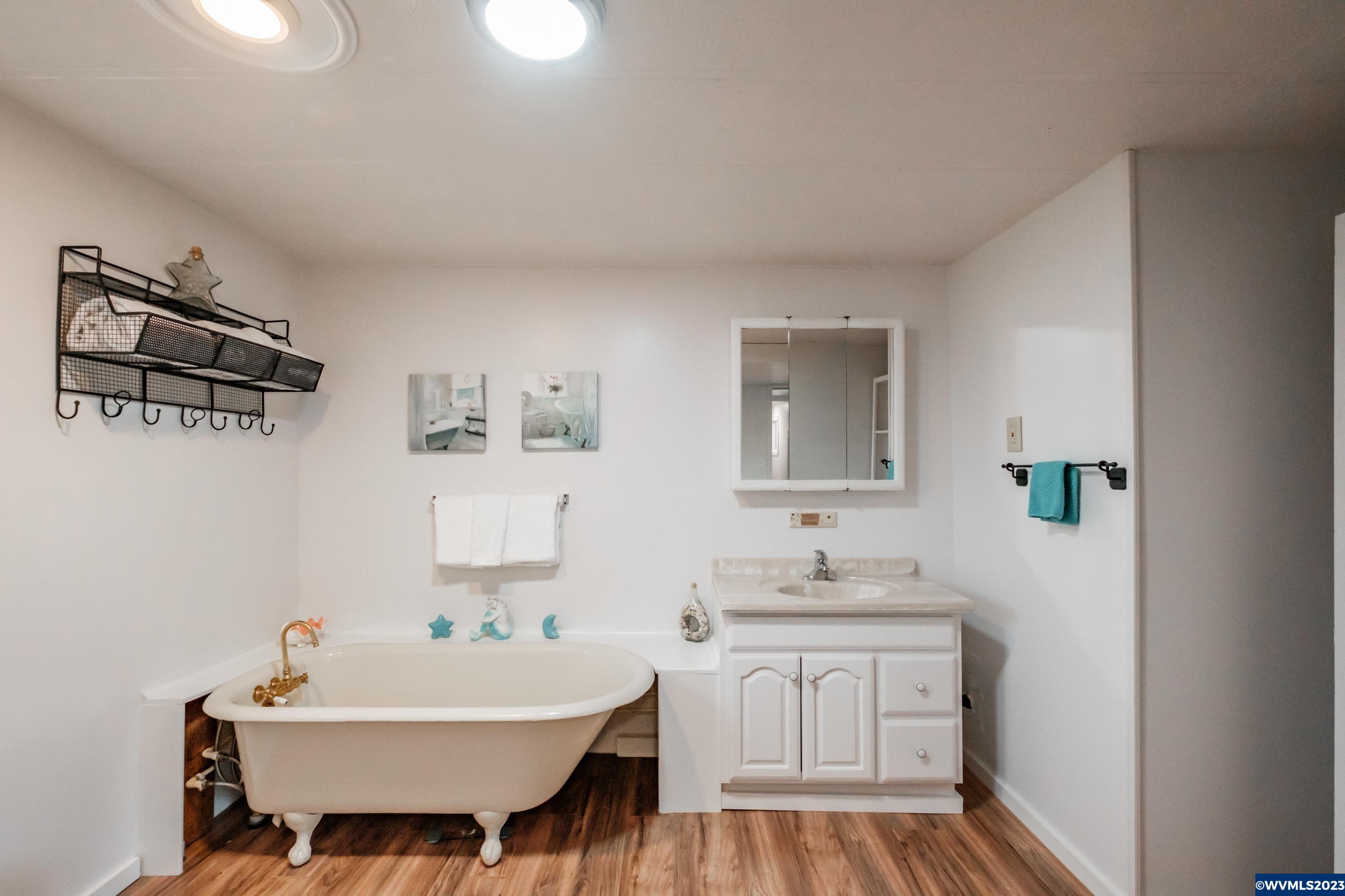 4915 Swegle Road Northeast, Unit 47 Salem, OR 97301 - Photo 32 of 36 a bathroom with a sink double vanity and a mirror