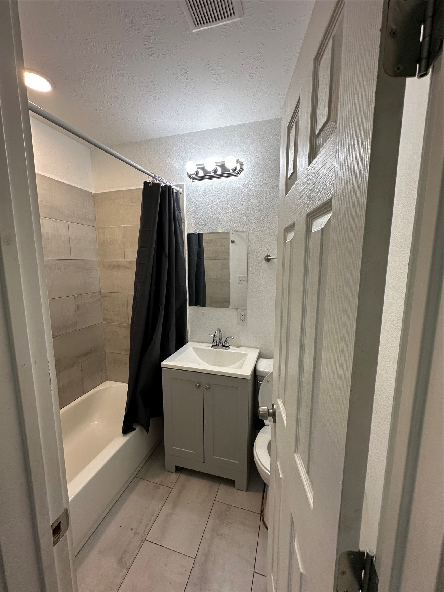 1405 Miles Street Houston, TX 77015 - Photo 8 of 9 a bathroom with a bathtub and sink
