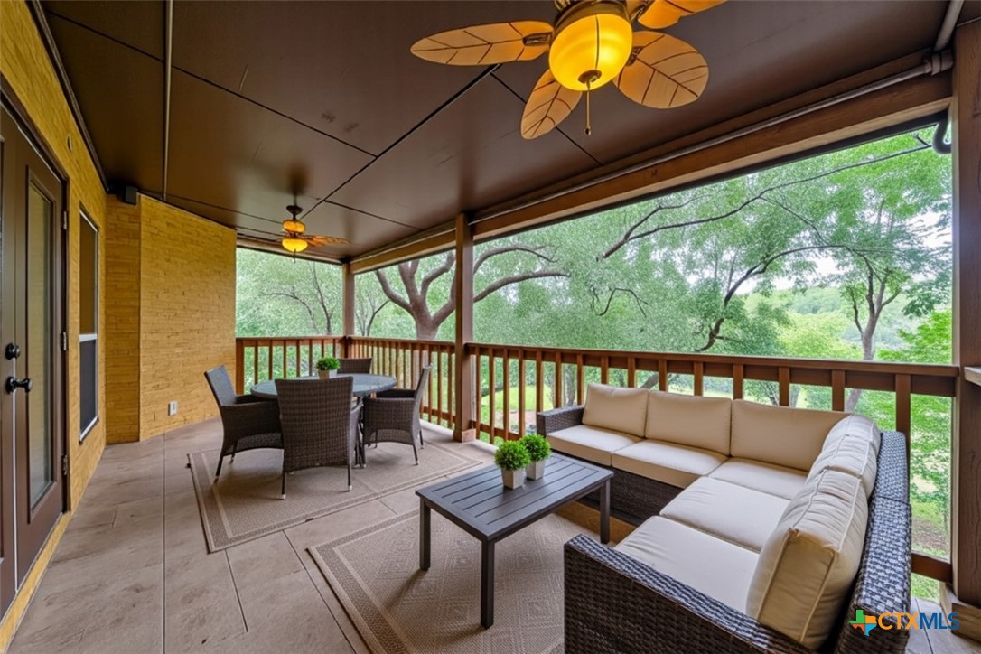 519 Long Meadow Spring Branch, TX 78070 - Photo 21 of 33 a balcony with couple of chairs and a potted plant