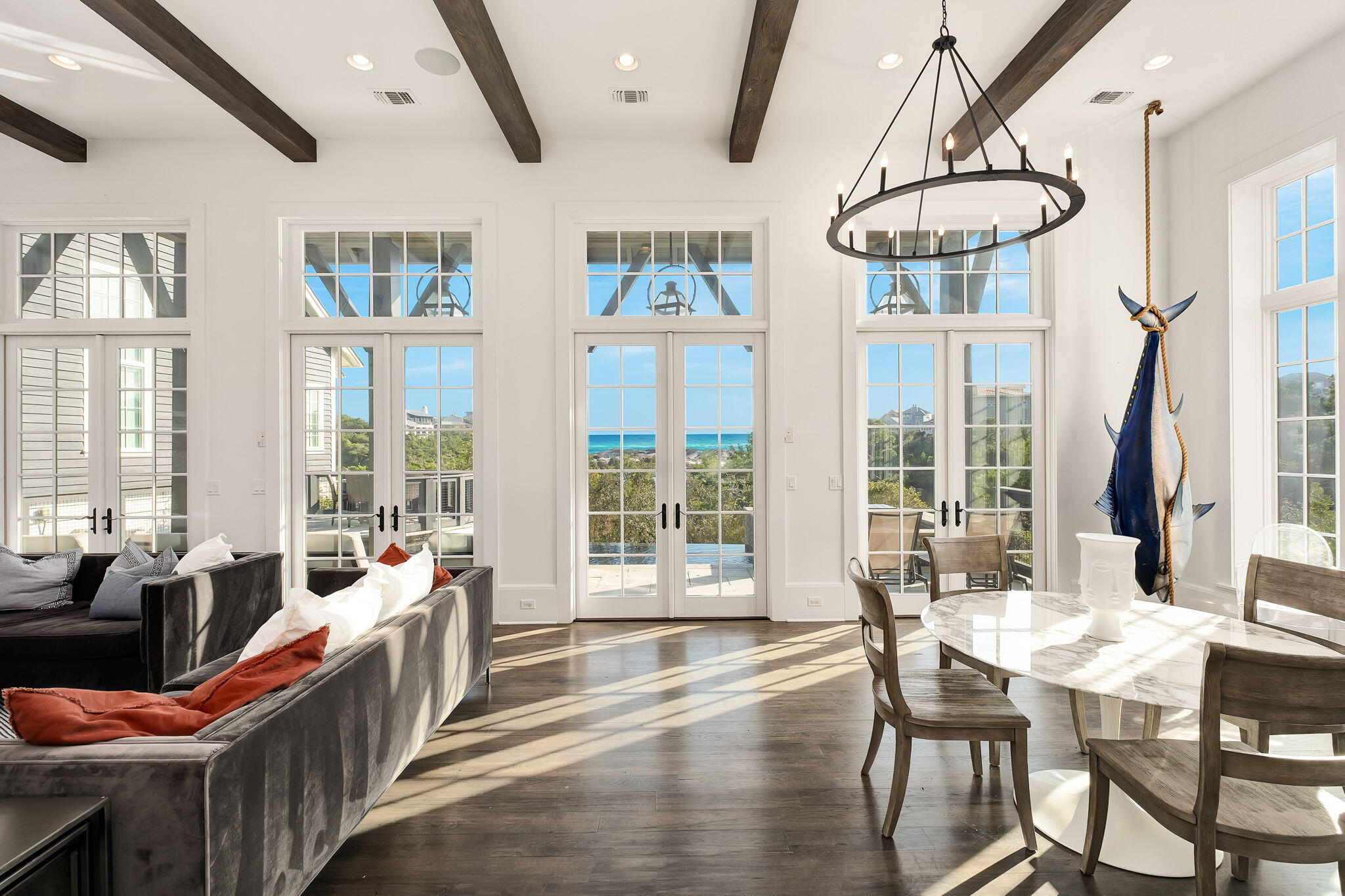 28 Bluff Lane Santa Rosa Beach, FL 32459 - Photo 12 of 24 a view of a dining room with furniture large windows and wooden floor