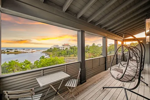 a view of a lake with houses in the back