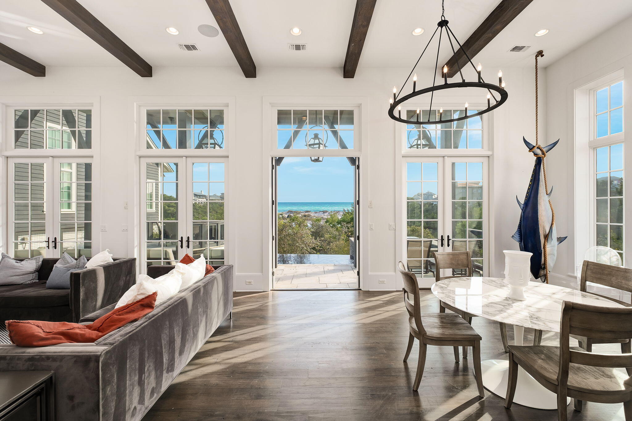 28 Bluff Lane Santa Rosa Beach, FL 32459 - Photo 6 of 24 a dining room with furniture a chandelier and wooden floor