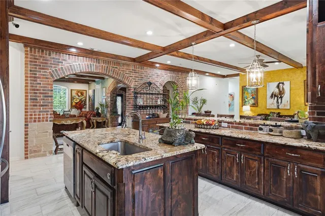 a kitchen with a stove and a sink