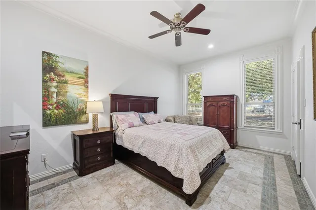 a bedroom with a large bed and a window