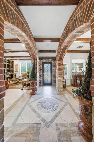 a aerial view of a house next to a yard