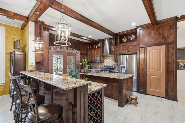 a kitchen with a table and chairs in it