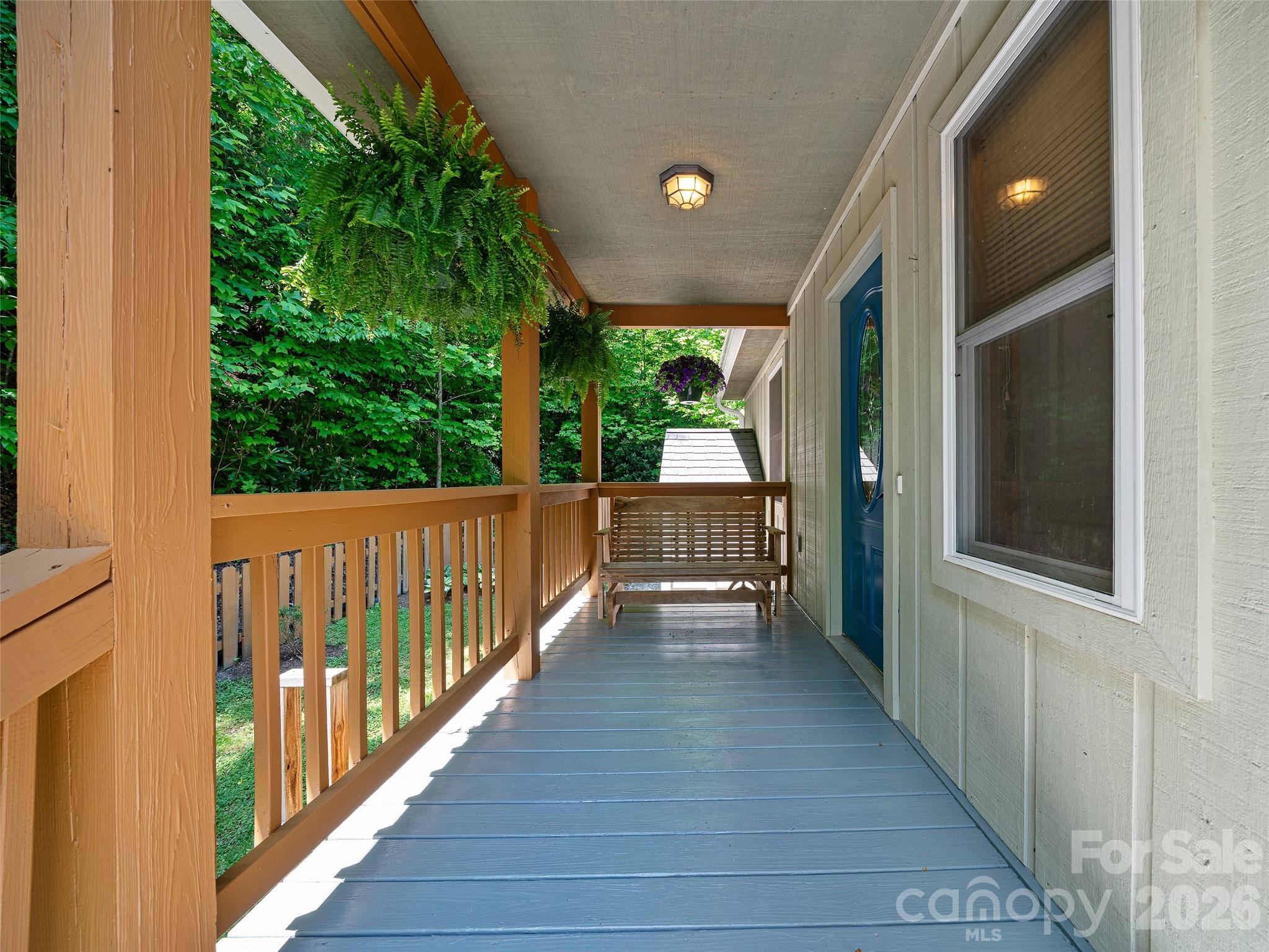 142 Wildflower Road Spruce Pine, NC 28777 - Photo 4 of 46 a view of a room with wooden floor and windows