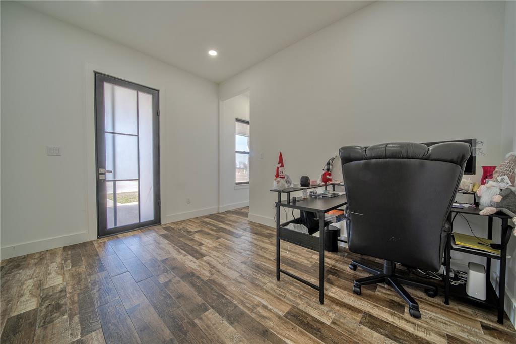 165 Ranch House Road Rockwall, TX 75032 - Photo 30 of 40 a view of a workspace with furniture and a window