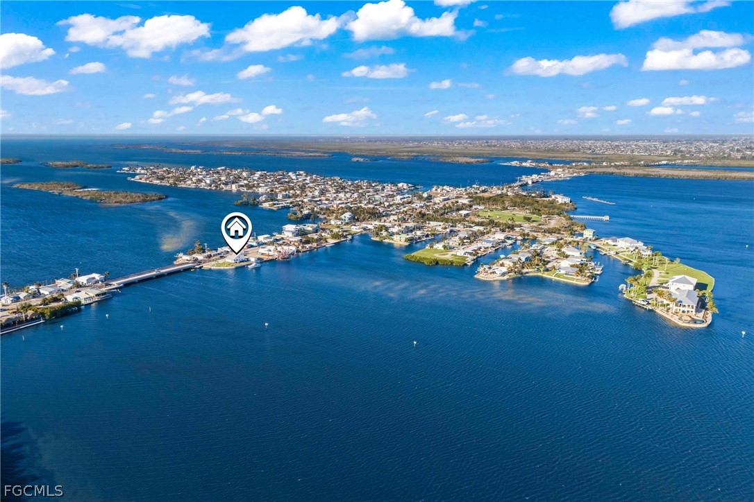 4767 Pine Island Road Cape Coral, FL 33993 - Photo 2 of 12 a view of a lake from a yard