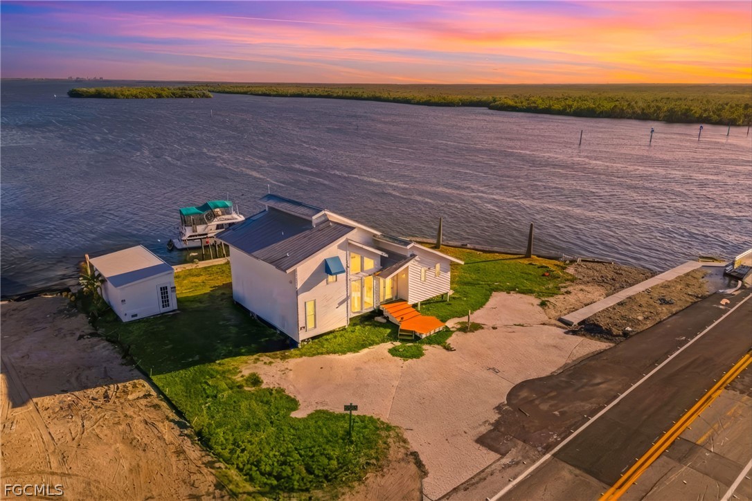 4767 Pine Island Road Cape Coral, FL 33993 - Photo 4 of 12 a view of an outdoor space and ocean view