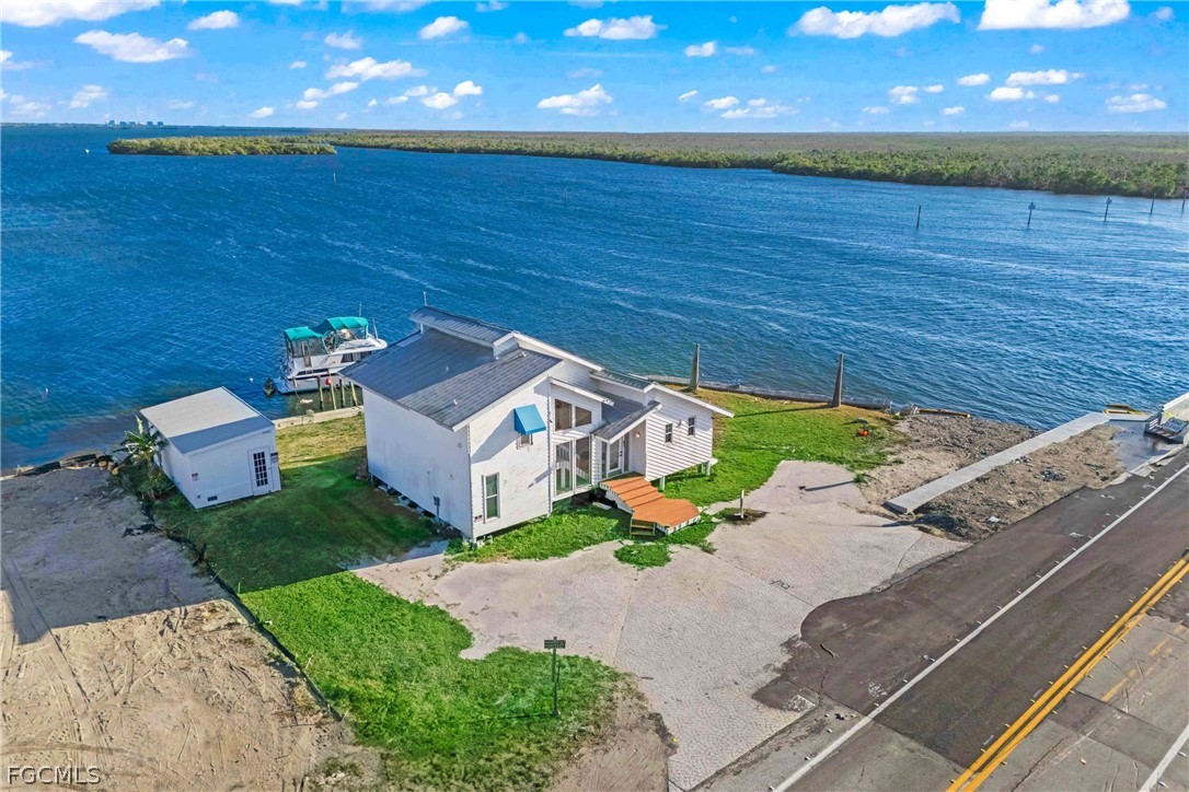 4767 Pine Island Road Cape Coral, FL 33993 - Photo 5 of 12 an aerial view of a house with a yard