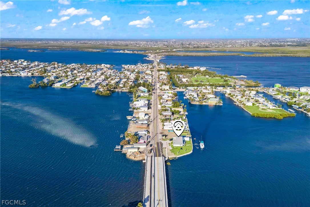 4767 Pine Island Road Cape Coral, FL 33993 - Photo 7 of 12 a view of an ocean and a building in the background