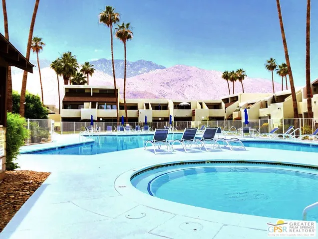 a view of a swimming pool with a patio