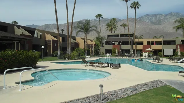 a view of a house with backyard porch and sitting area