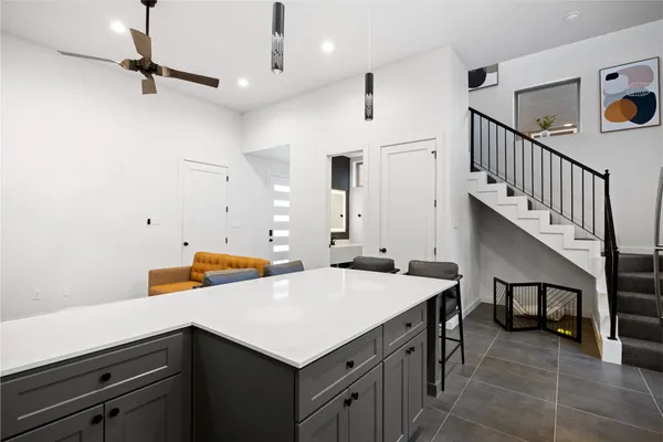 a utility room with sink and cabinets