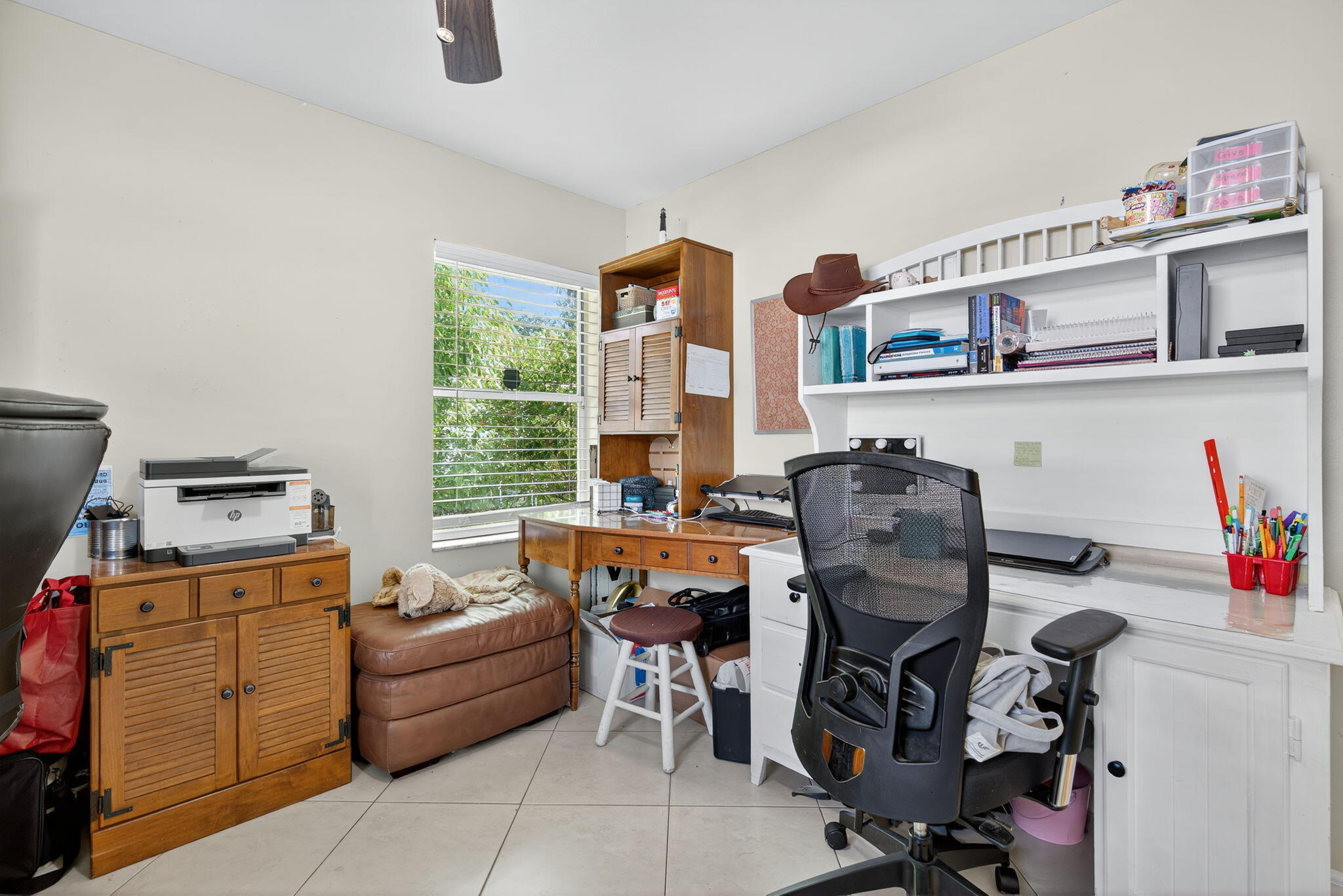 6877 3rd Street Jupiter, FL 33458 - Photo 15 of 25 a bed room with furniture and a window