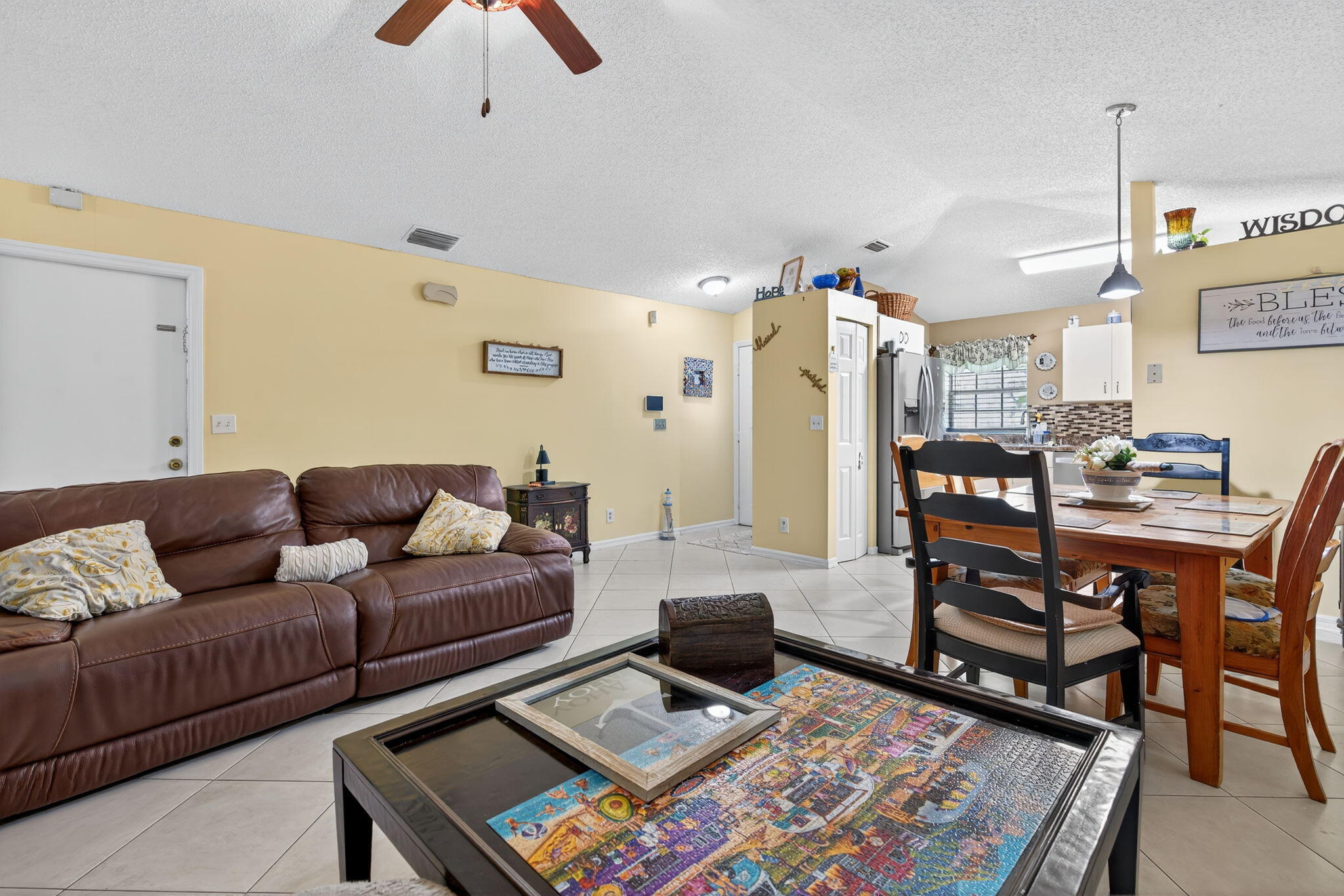 6877 3rd Street Jupiter, FL 33458 - Photo 5 of 25 a living room with furniture rug and window