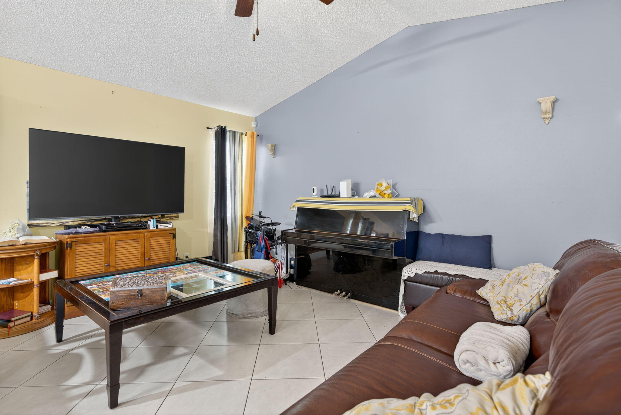 6877 3rd Street Jupiter, FL 33458 - Photo 6 of 25 a living room with furniture and a flat screen tv