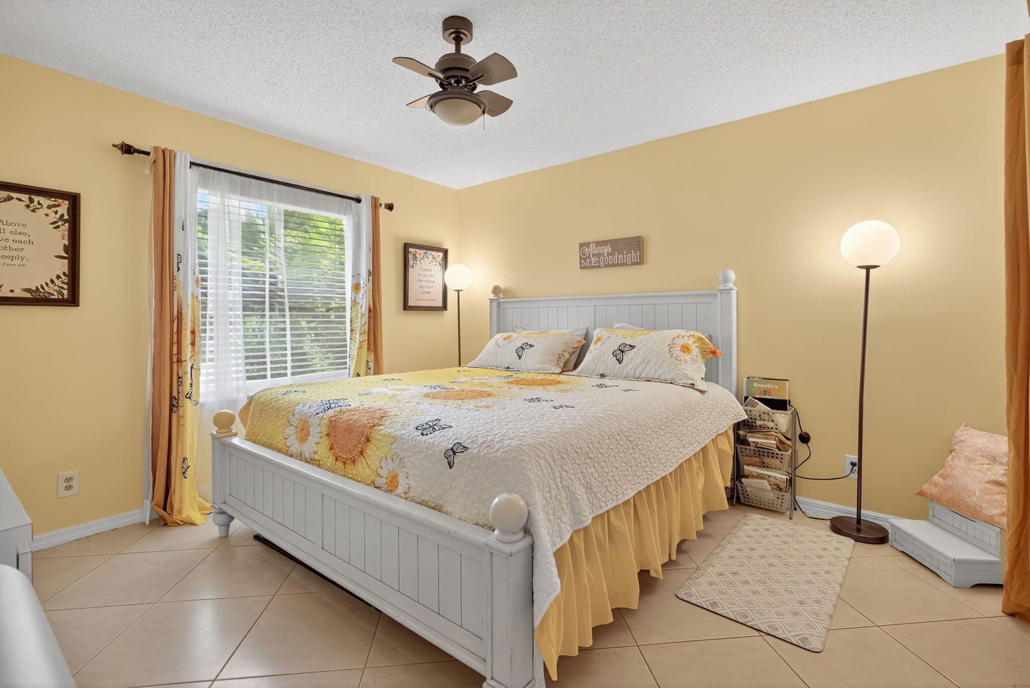 6877 3rd Street Jupiter, FL 33458 - Photo 8 of 25 a bed sitting in a spacious bedroom next to a window