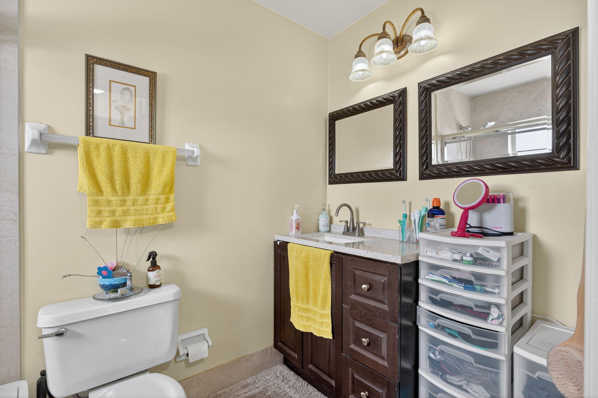 6877 3rd Street Jupiter, FL 33458 - Photo 10 of 25 a bathroom with a granite countertop sink mirror vanity and toilet