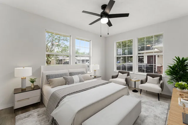 a bedroom with a large bed and a couch