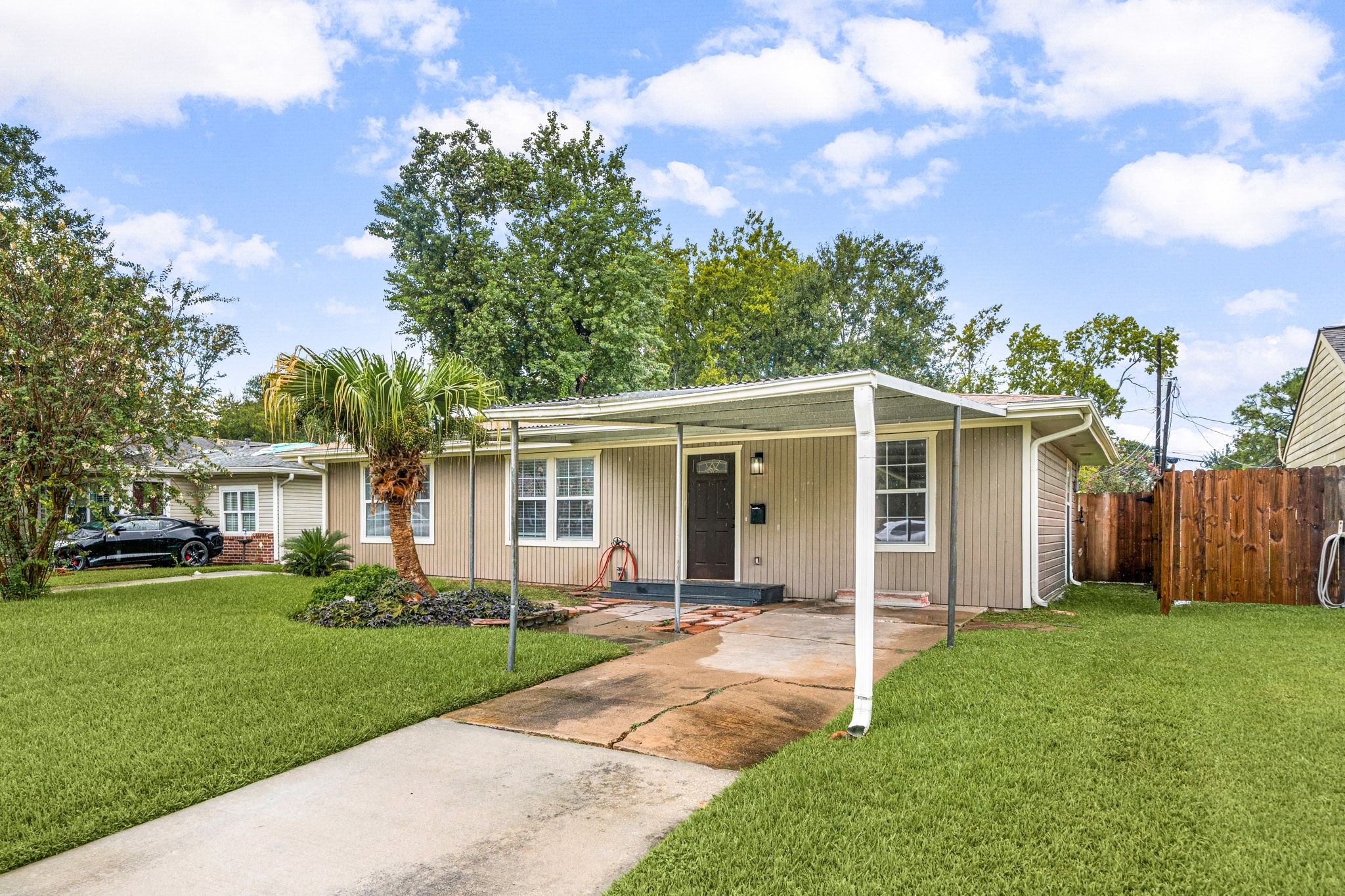 1206 Oak Meadows Street Houston, TX 77017 - Photo 22 of 32 a view of a house with a yard and potted plants