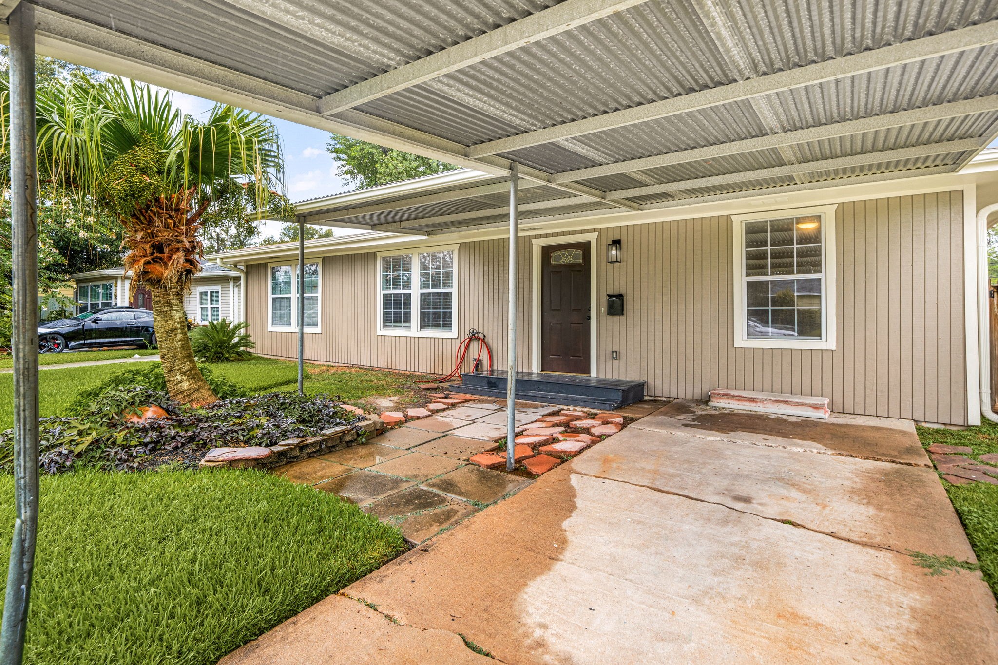 1206 Oak Meadows Street Houston, TX 77017 - Photo 24 of 32 a front view of a house with garden