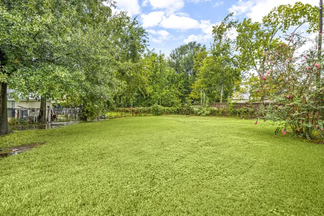 a view of outdoor space with deck and yard